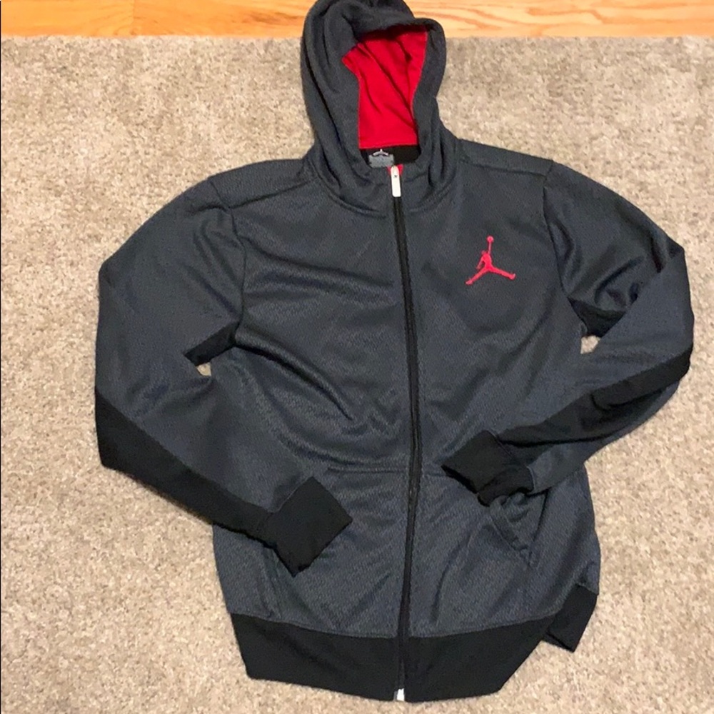 This is a grey and red Jordan hoodie